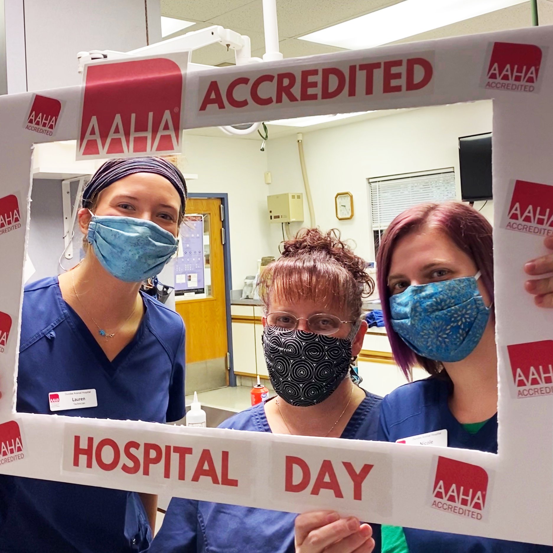 Team members at Illinois-based Dundee Animal Hospital model an AAHA-accredited selfie frame.