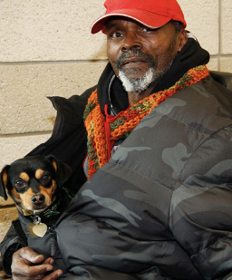 dog_in_man’s_jacket-_Photo_courtesy_of_Feeding_Pets_of_the_Homeless.jpg