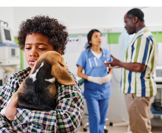 Worried child holding dog