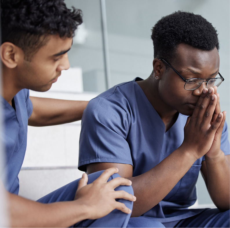 Technician consoling his fellow co-worker