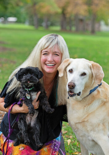 Writer Jen Reeder poses with her dogs