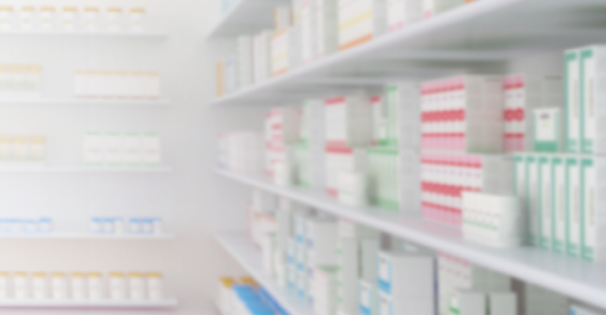 A blurred image of a stock room filled with shelves of inventory