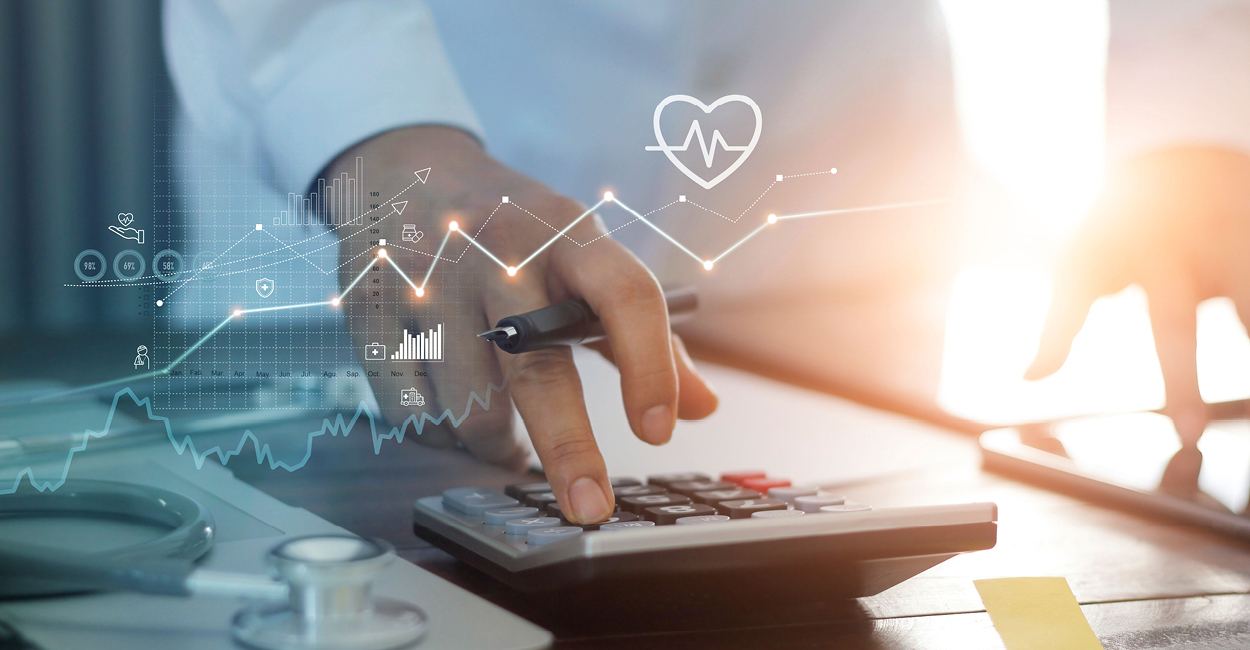 Closeup photo of a doctor using a calculator with an overlay of financial graphs and information to represent practice finance