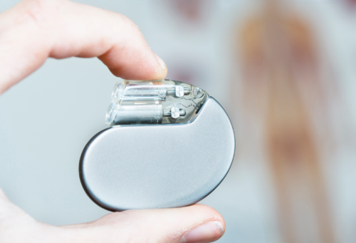 someone holding a pacemaker in their hand