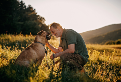 man with dog outdoors
