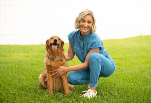 veterinarian with golden retriever