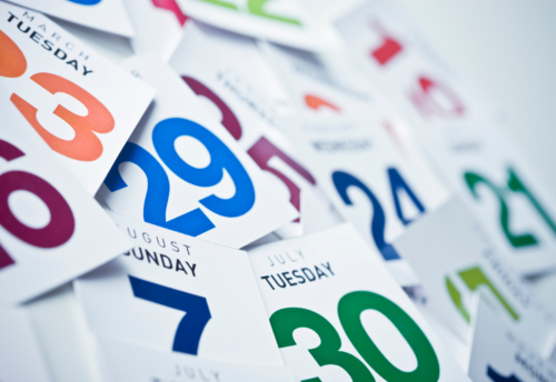 This image features individual pages of a calendar with various dates in various colors scattered about