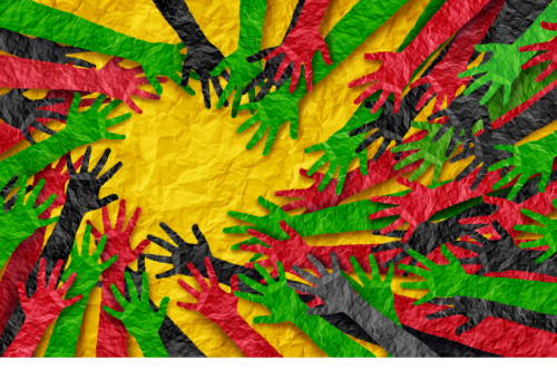 paper cut outs in the shape of outstretched hands that are green, green, red and black all reaching toward each other in a circular pattern on a yellow background