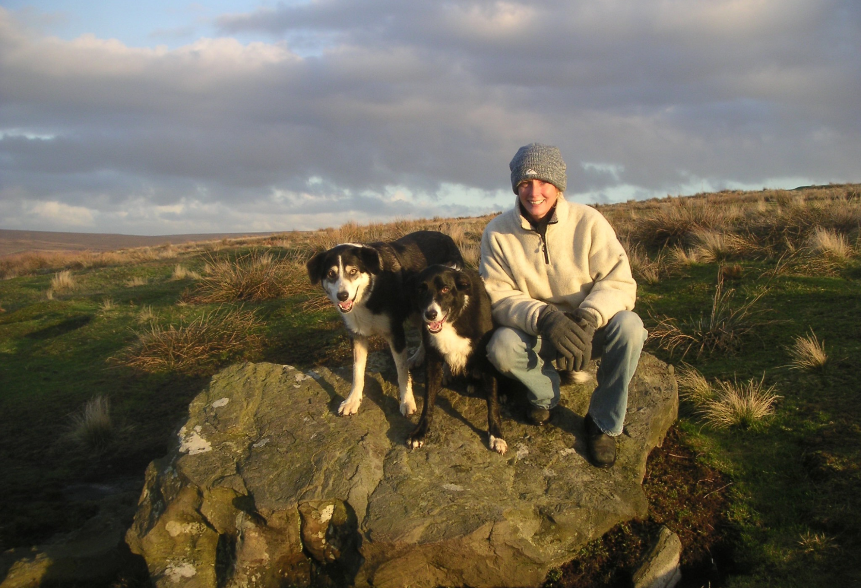 Veterinarian Emma Milne with her dogs outside