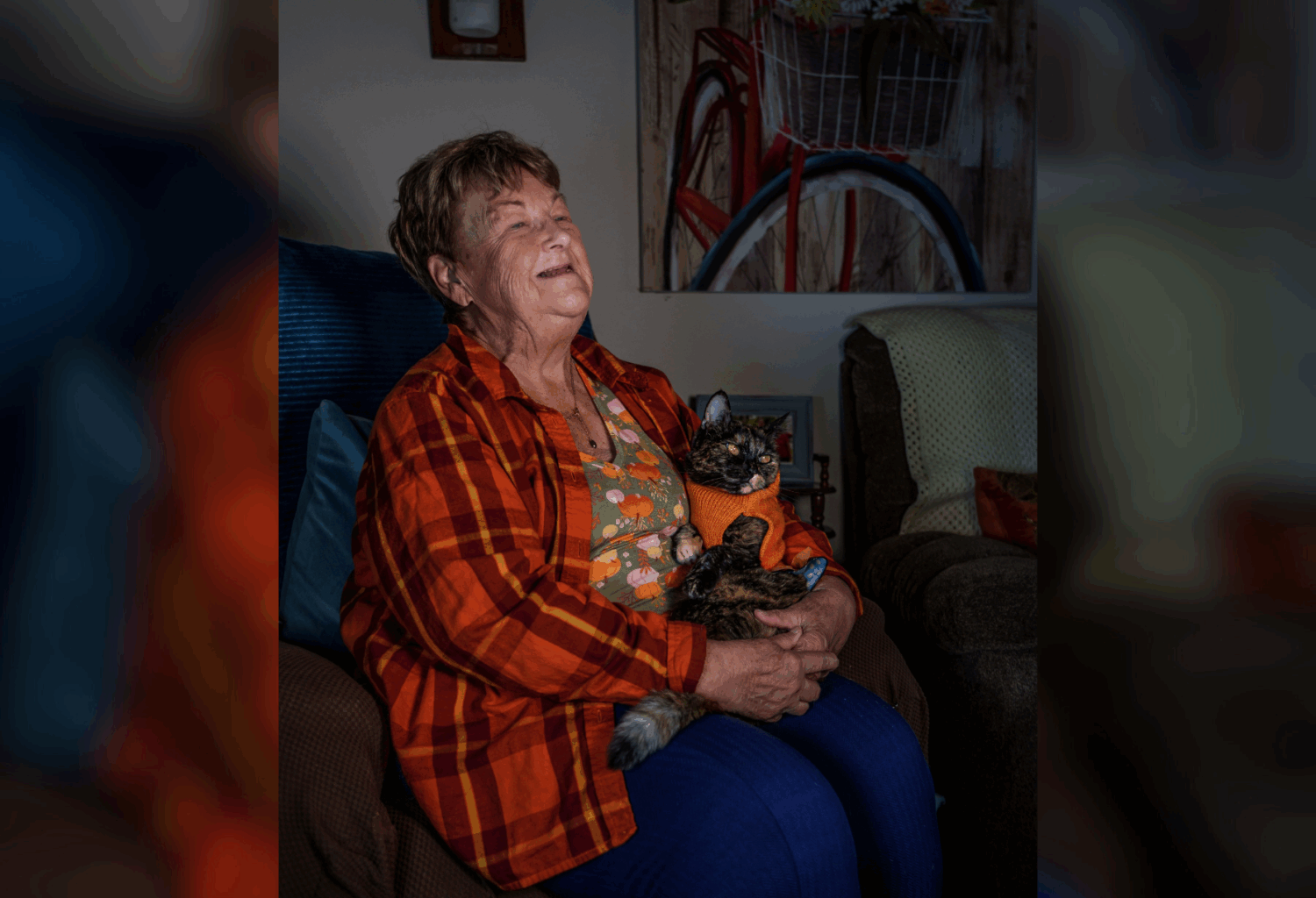 A woman holds her cat