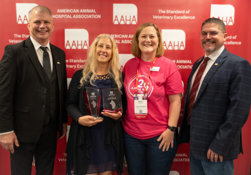 AAHA's 2025 Accredited Practice of the Year Award winner with her Practice Consultant, Melissa Hendrix and two board members inclduing past president fo the board Dr. Mark Thompson and current president Dr. Scott Driever