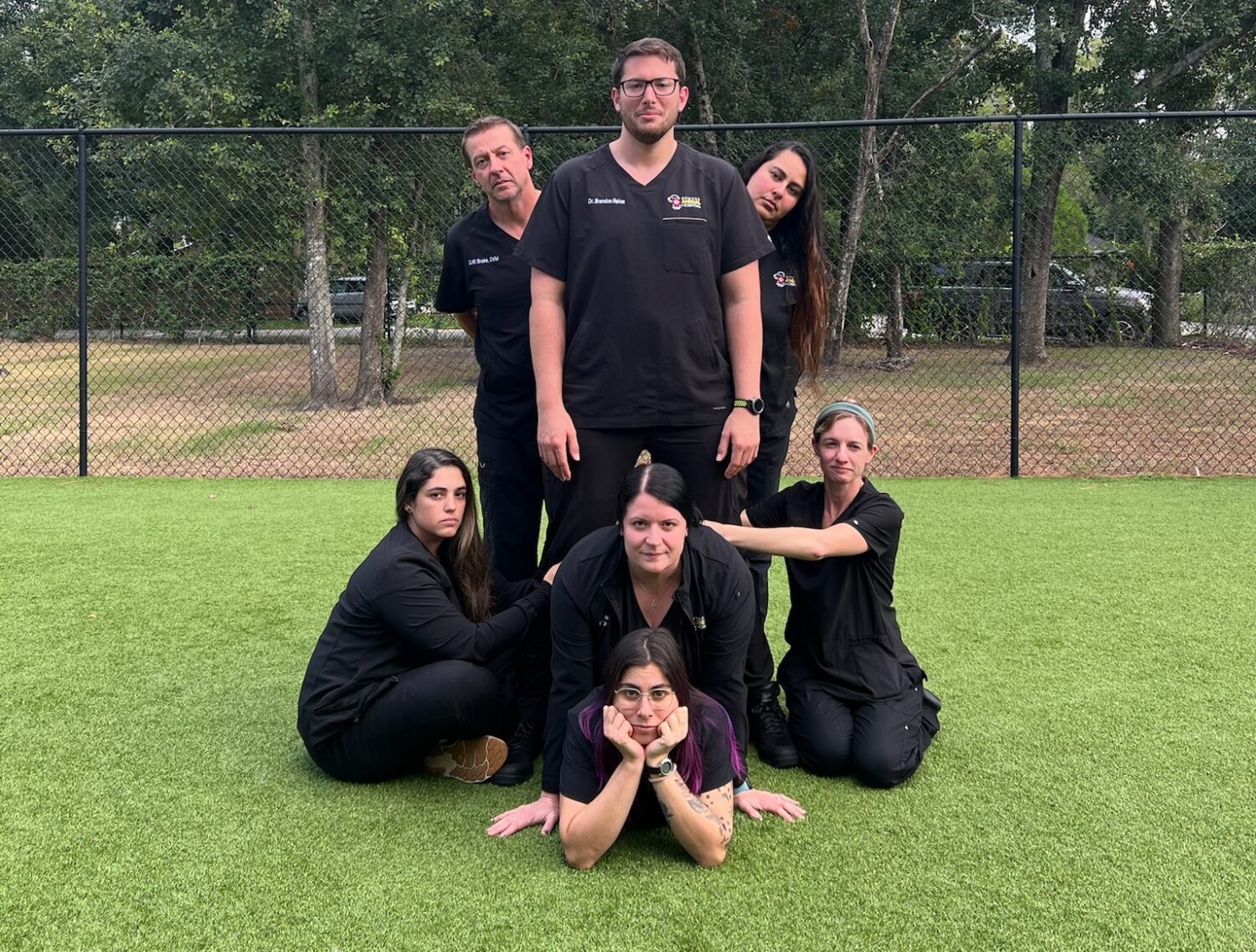 Staff at Cheval Animal Hospital pose for a JCP inspired hospital team photo.