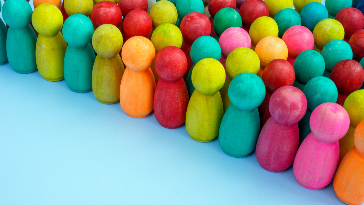 Crowd of colored figures as a symbol of diversity and inclusion.