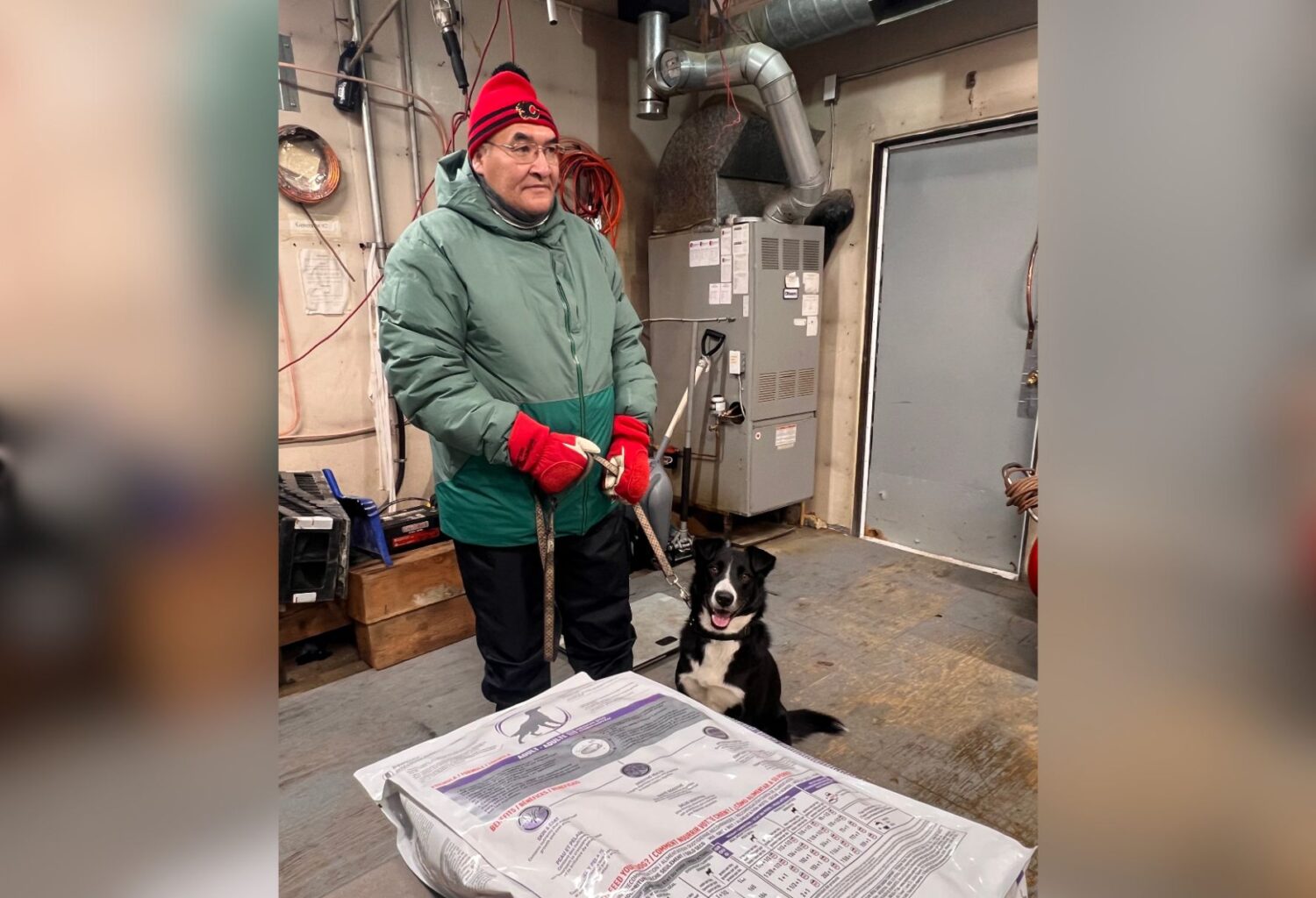Man and dog in Old Crow, Canada